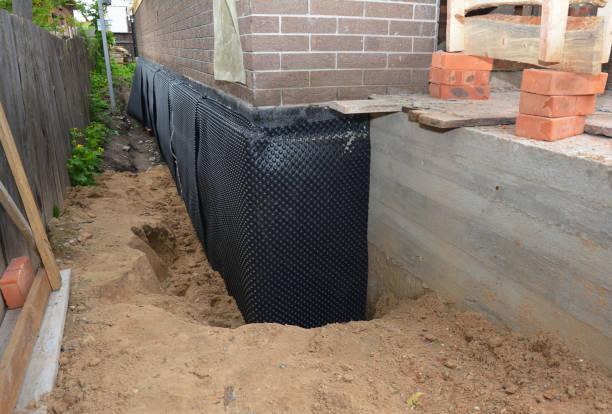 Happy homeowners after waterproofing job in Crittenden